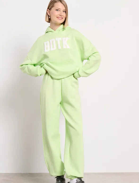 Women's high-waisted jogger pants `CAPITAL LOGO` | Bodytalk